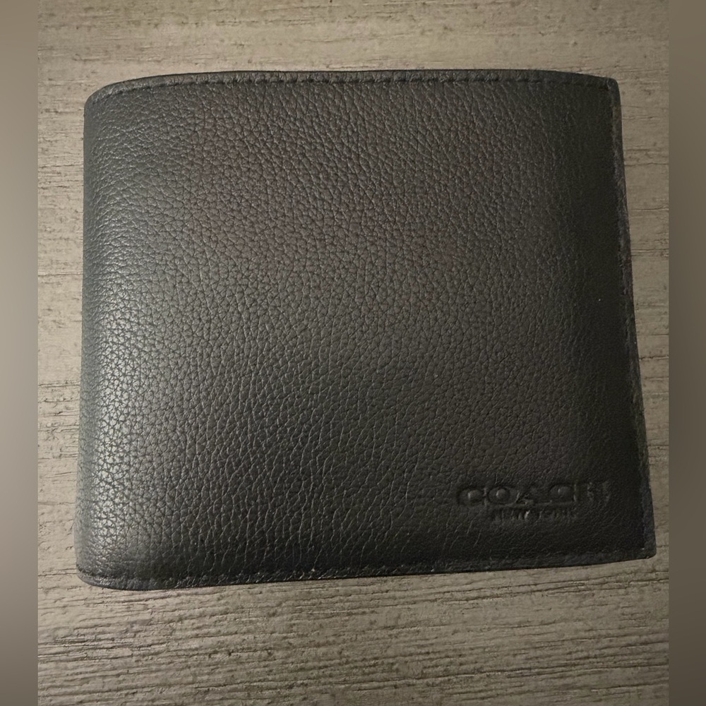 Authentic black Coach men’s wallet.